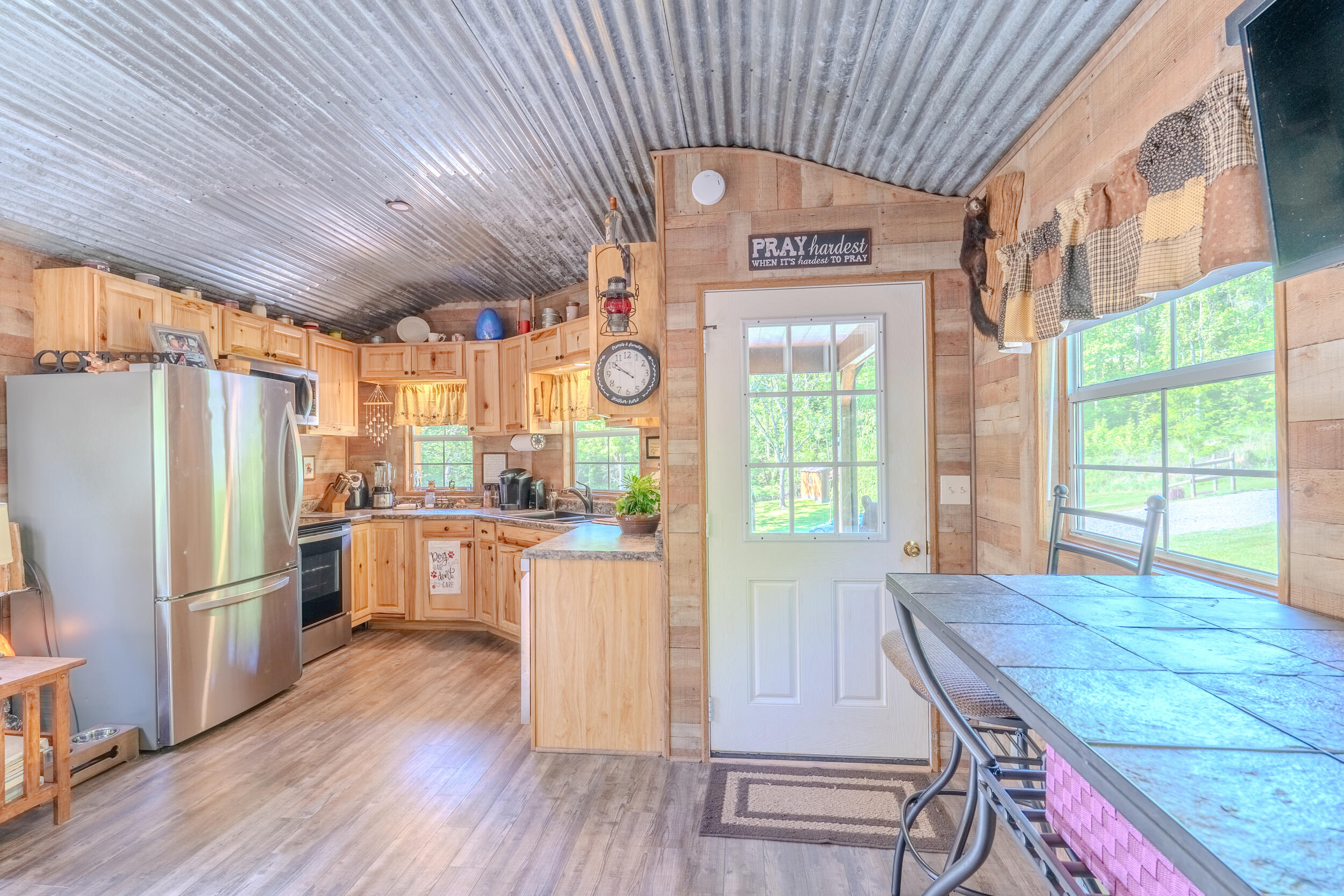2100 Nemmo Road Vinton, VA 24179 - Photo 6 of 38 a kitchen with stainless steel appliances granite countertop a refrigerator a oven a stove and white cabinets with wooden floor