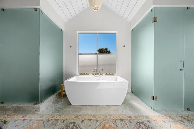 a bathroom with a sink and mirror