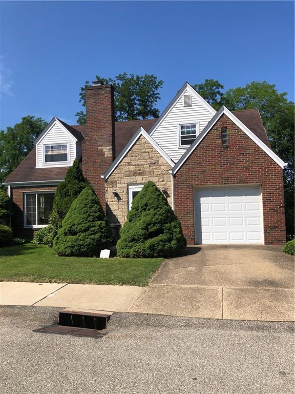 300 Radisson Road Pittsburgh, PA 15227 - Photo 1 of 31 a front view of a house with a yard and garage