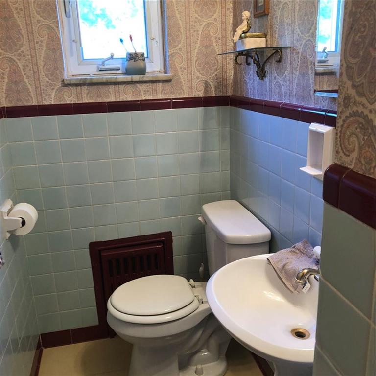 300 Radisson Road Pittsburgh, PA 15227 - Photo 11 of 31 a bathroom with a toilet a sink and mirror