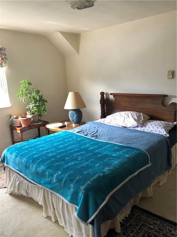 300 Radisson Road Pittsburgh, PA 15227 - Photo 12 of 31 a bed sitting in a bedroom next to a lamp