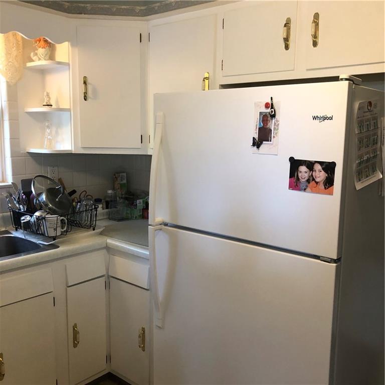 300 Radisson Road Pittsburgh, PA 15227 - Photo 6 of 31 a white refrigerator freezer sitting inside of a kitchen