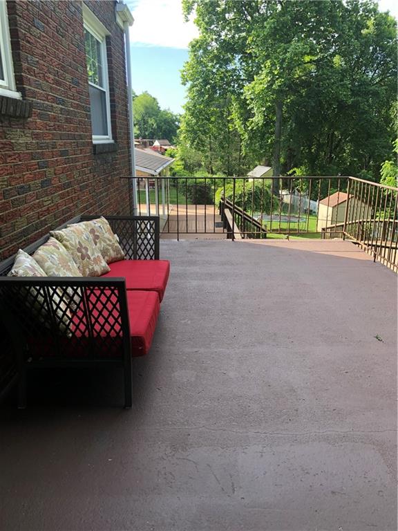 300 Radisson Road Pittsburgh, PA 15227 - Photo 9 of 31 a view of a chairs and table in the back yard of the house