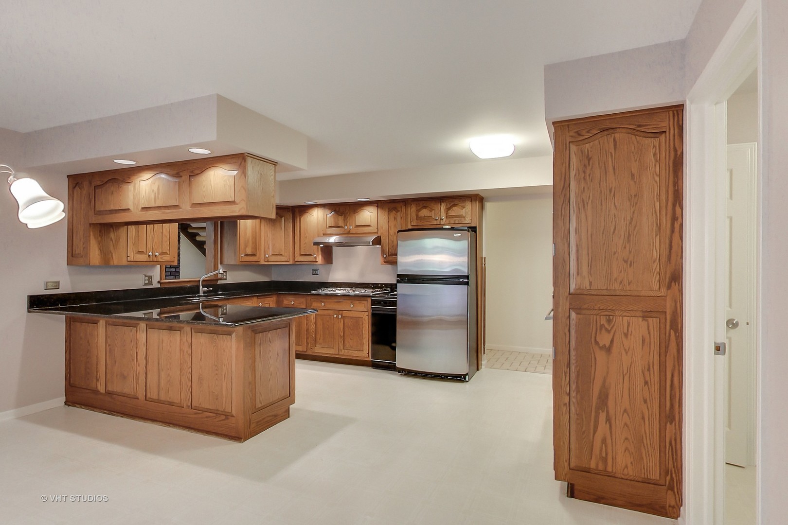 19 Marryat Road Trout Valley, IL 60013 - Photo 11 of 42 a kitchen with granite countertop a refrigerator and a sink