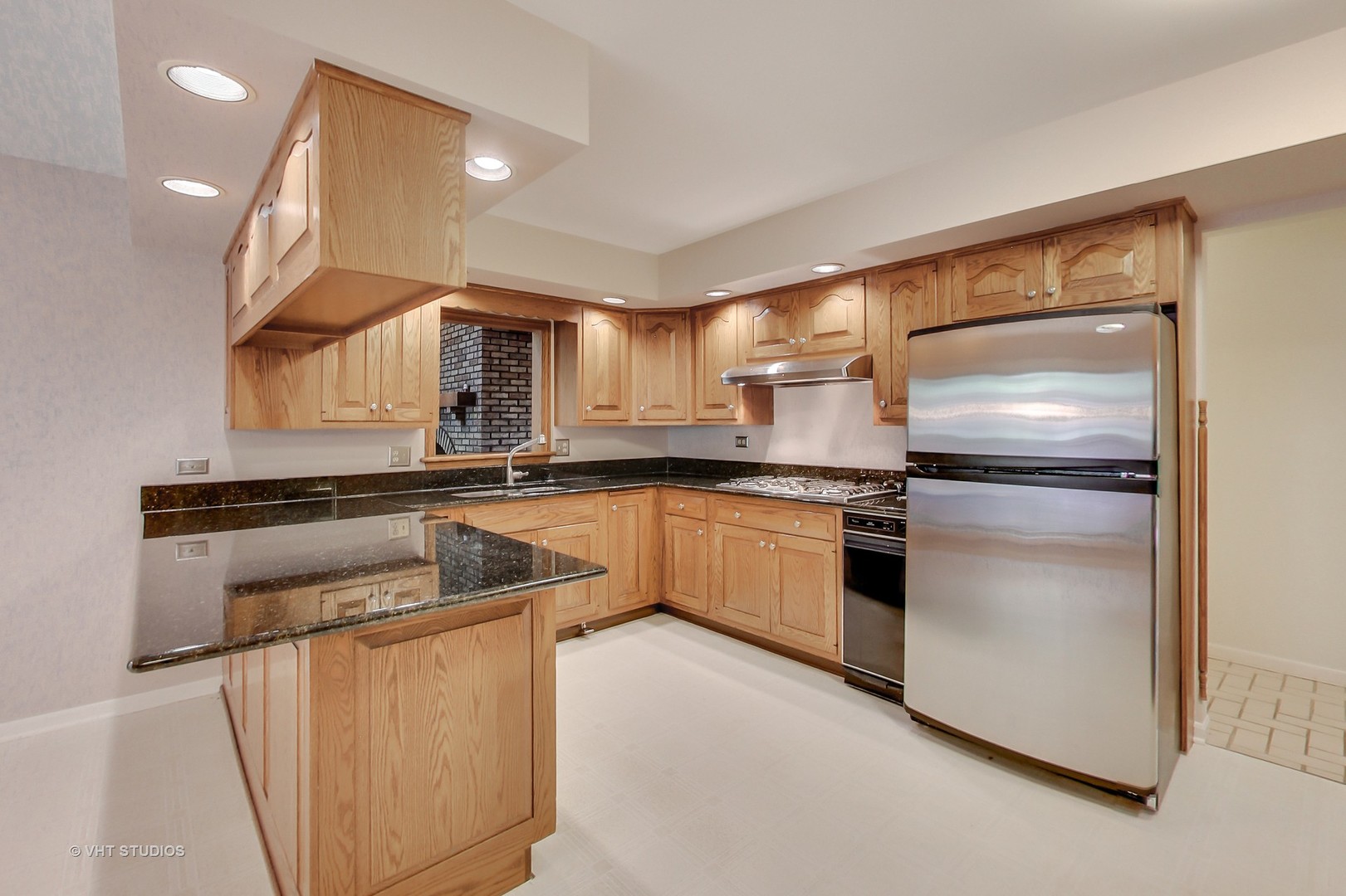 19 Marryat Road Trout Valley, IL 60013 - Photo 10 of 42 a kitchen with cabinets and stainless steel appliances