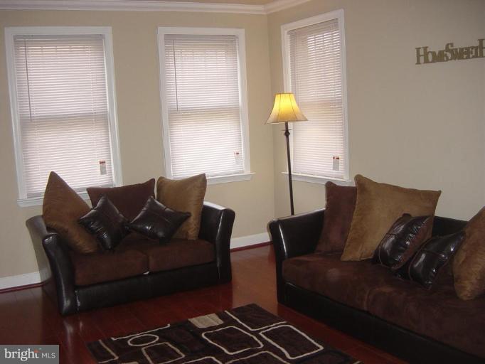 4035 Hilton Road Baltimore, MD 21215 - Photo 2 of 19 New windows, paint and Crown Molding
