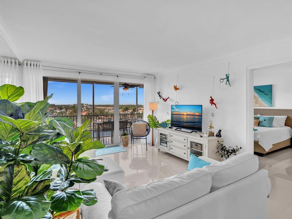 3100 South Ocean Boulevard, Unit 712 Highland Beach, FL 33487 - Photo 14 of 50 a living room with furniture a wooden floor and a fireplace