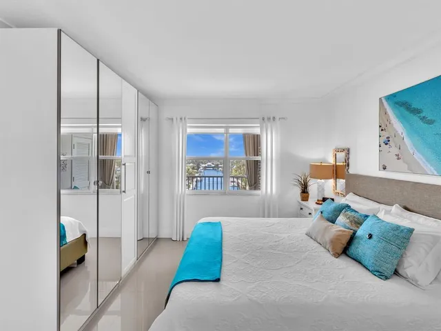 a bedroom with a large bed and a couch