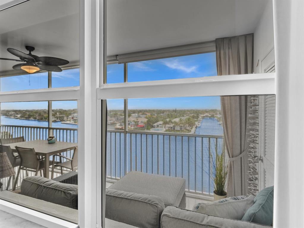 3100 South Ocean Boulevard, Unit 712 Highland Beach, FL 33487 - Photo 19 of 50 a living room with furniture and a floor to ceiling window