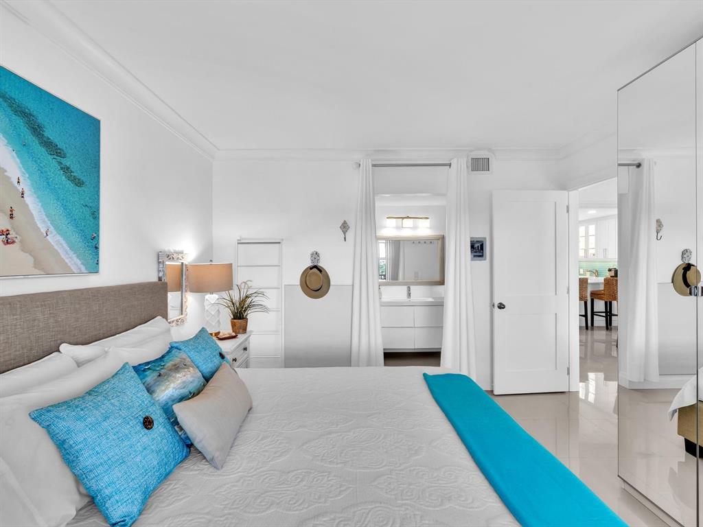 3100 South Ocean Boulevard, Unit 712 Highland Beach, FL 33487 - Photo 20 of 50 a bedroom with a bed and a couch