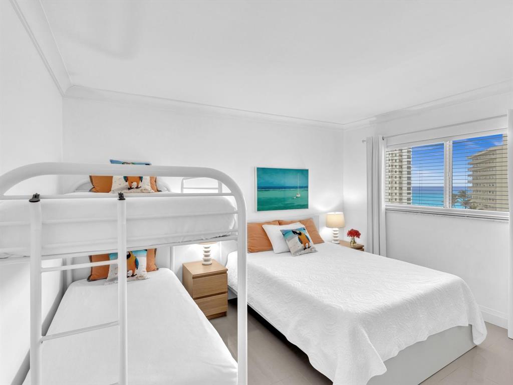 3100 South Ocean Boulevard, Unit 712 Highland Beach, FL 33487 - Photo 25 of 50 a bed room with two beds and a window