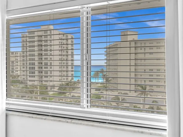 a bathroom with a shower and a window