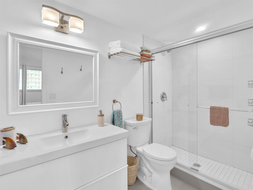 3100 South Ocean Boulevard, Unit 712 Highland Beach, FL 33487 - Photo 29 of 50 a bathroom with a sink toilet and shower
