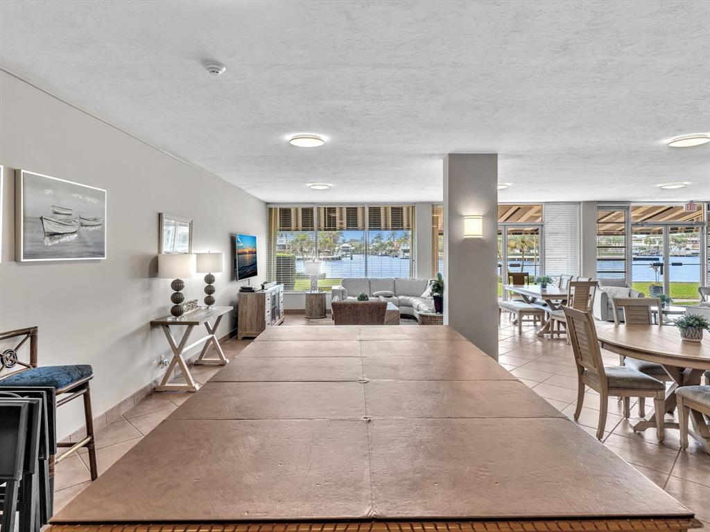 3100 South Ocean Boulevard, Unit 712 Highland Beach, FL 33487 - Photo 36 of 50 a living room with furniture and a table