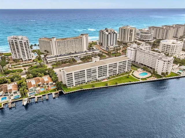 a view of a balcony with two chairs and a table