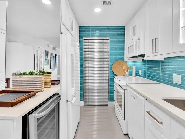 a kitchen that has a sink and a stove