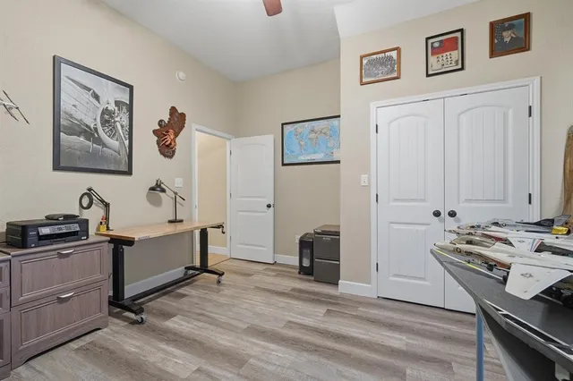 a view of a workspace with furniture and bedroom