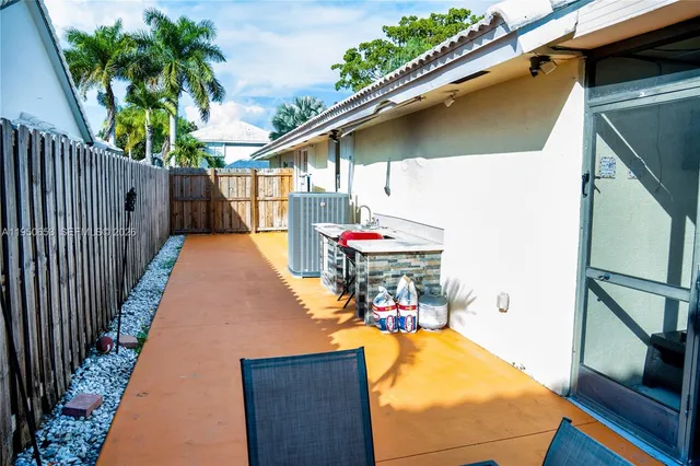 a view of swimming pool with a patio