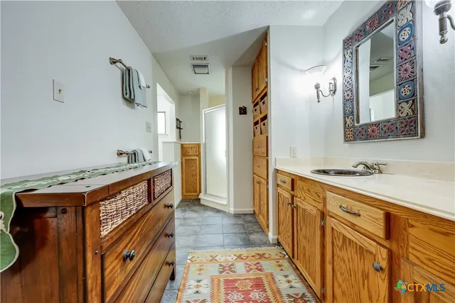 a kitchen with a stove and a refrigerator