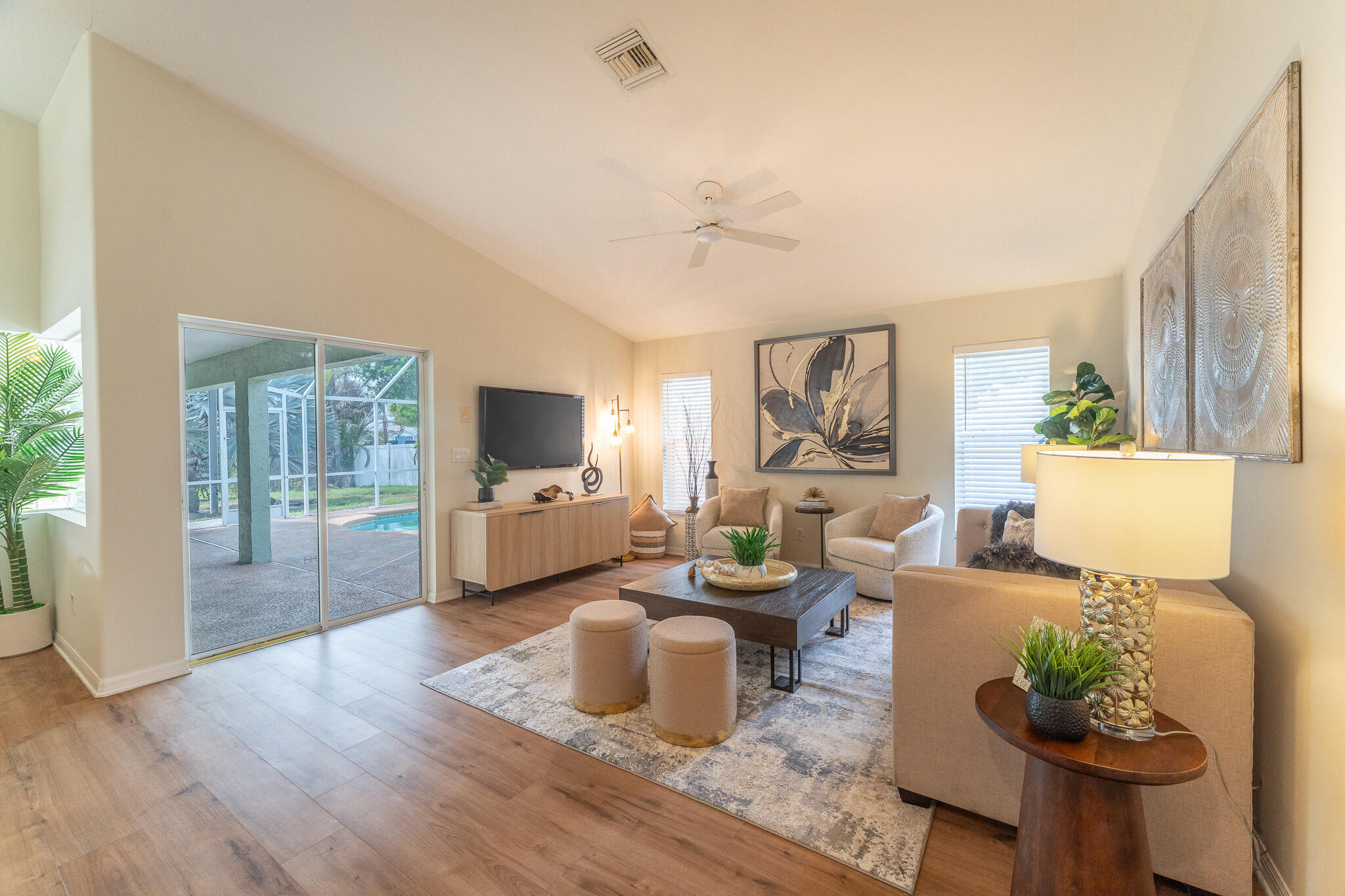 513 Southeast Cliff Road Port St. Lucie, FL 34984 - Photo 11 of 31 a living room with furniture and wooden floor