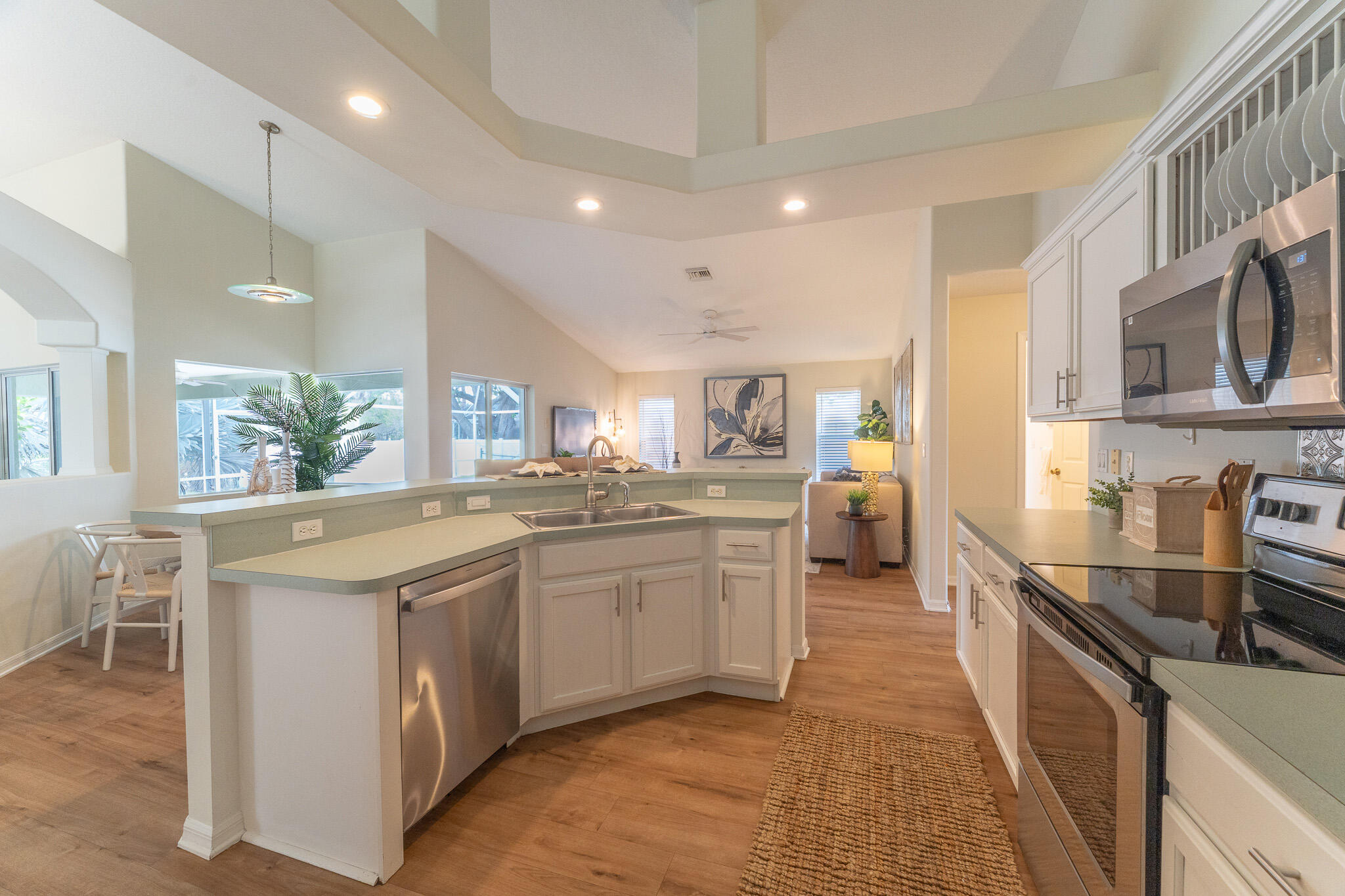 513 Southeast Cliff Road Port St. Lucie, FL 34984 - Photo 13 of 31 a kitchen with stainless steel appliances granite countertop a stove and a sink