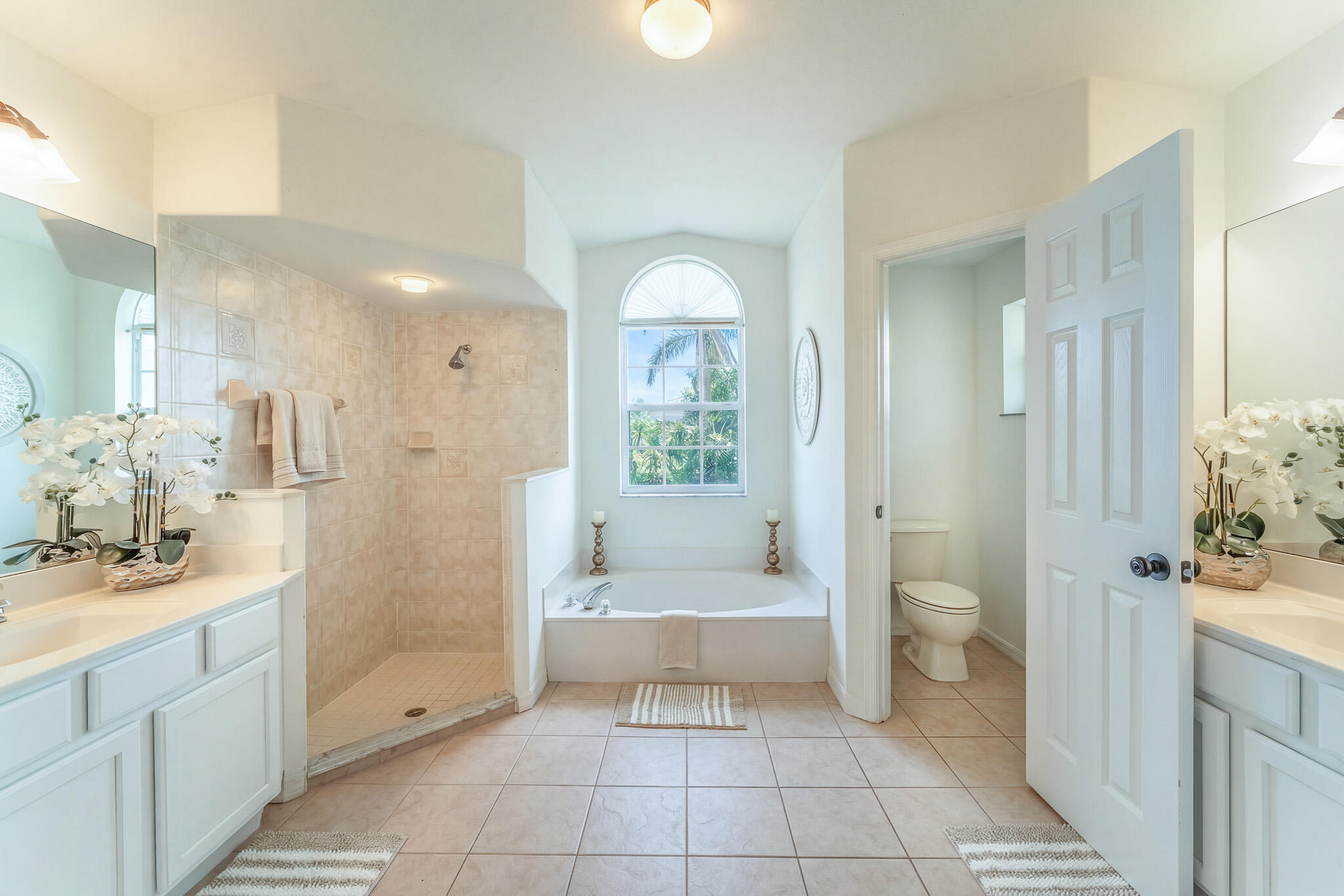 513 Southeast Cliff Road Port St. Lucie, FL 34984 - Photo 20 of 31 a bathroom with a sink a toilet and shower