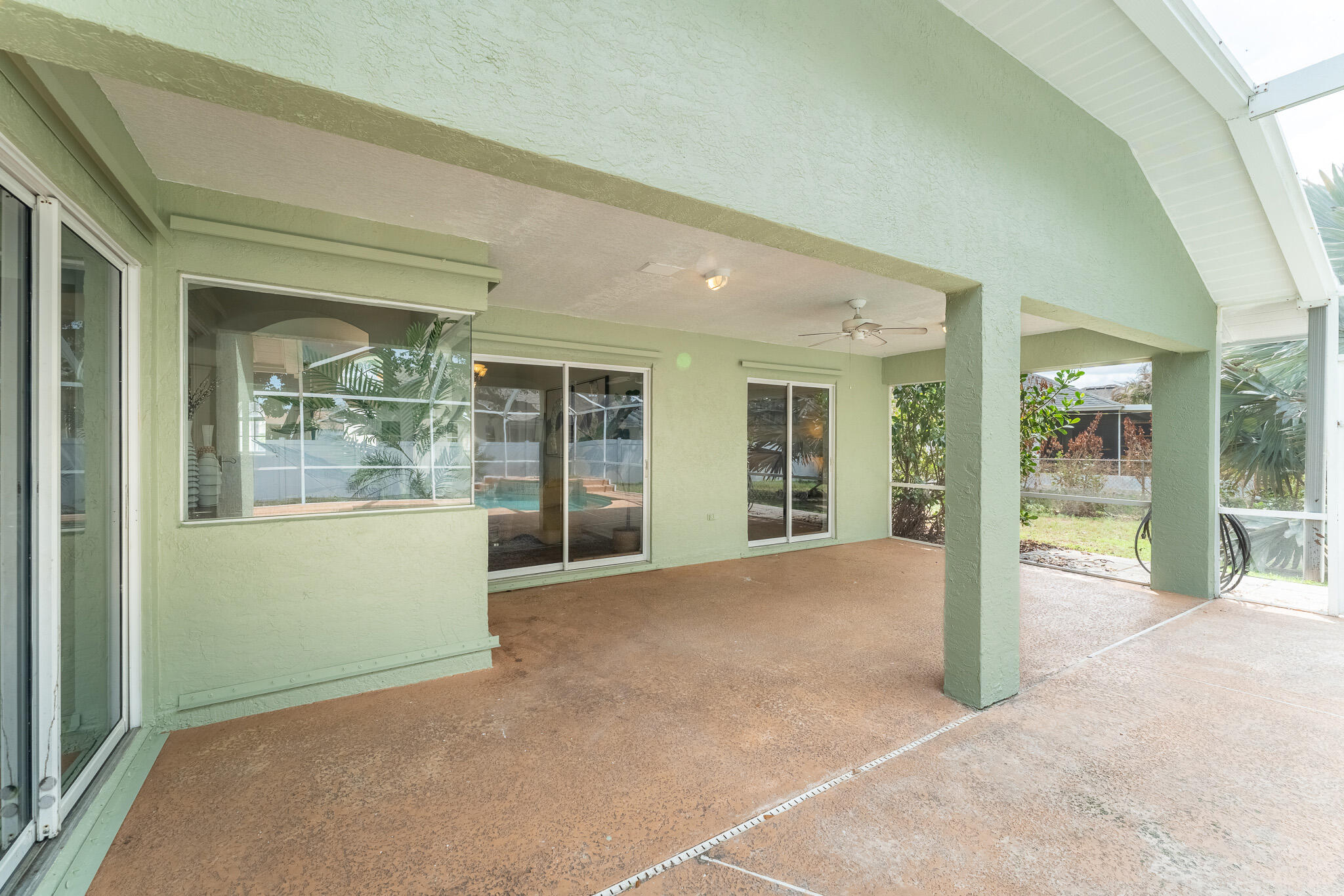 513 Southeast Cliff Road Port St. Lucie, FL 34984 - Photo 25 of 31 a view of an empty room with floor to ceiling windows