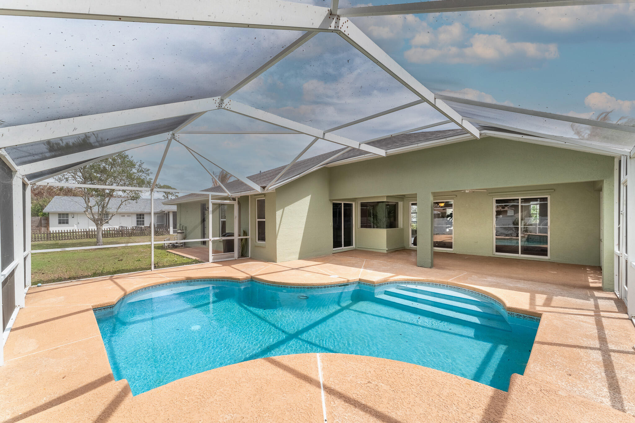 513 Southeast Cliff Road Port St. Lucie, FL 34984 - Photo 26 of 31 a house with outdoor space