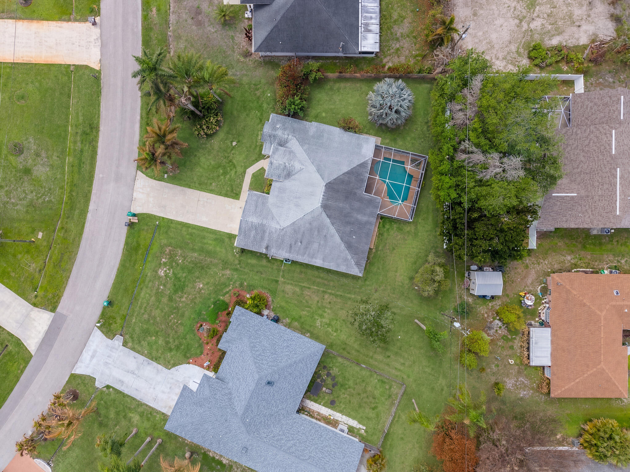 513 Southeast Cliff Road Port St. Lucie, FL 34984 - Photo 30 of 31 an aerial view of a house with garden space and a patio