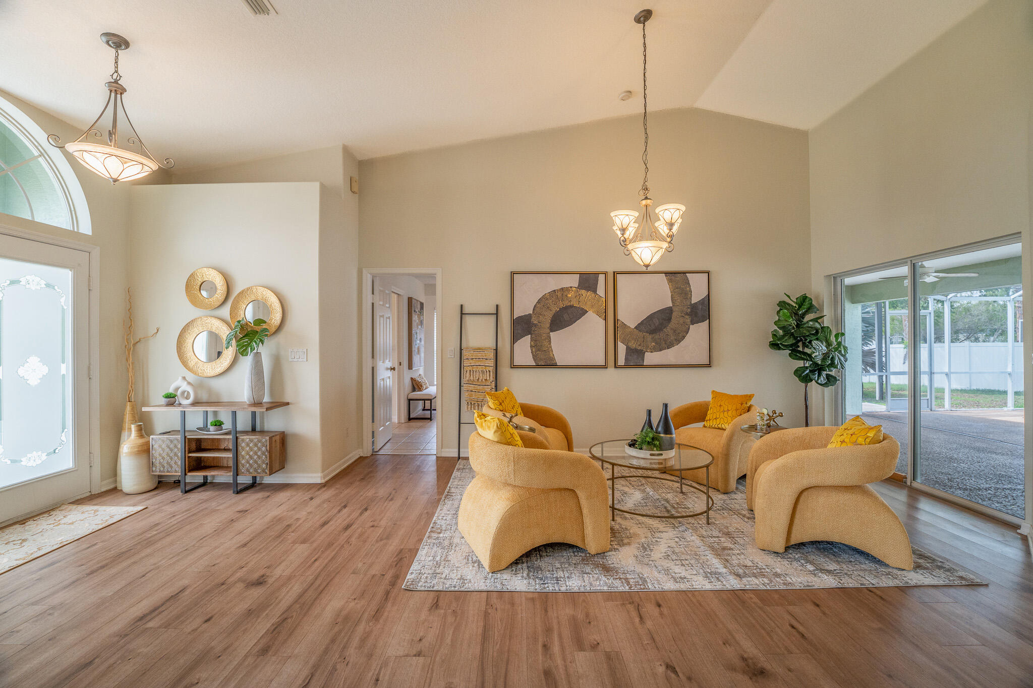 513 Southeast Cliff Road Port St. Lucie, FL 34984 - Photo 6 of 31 a living room with furniture and wooden floor