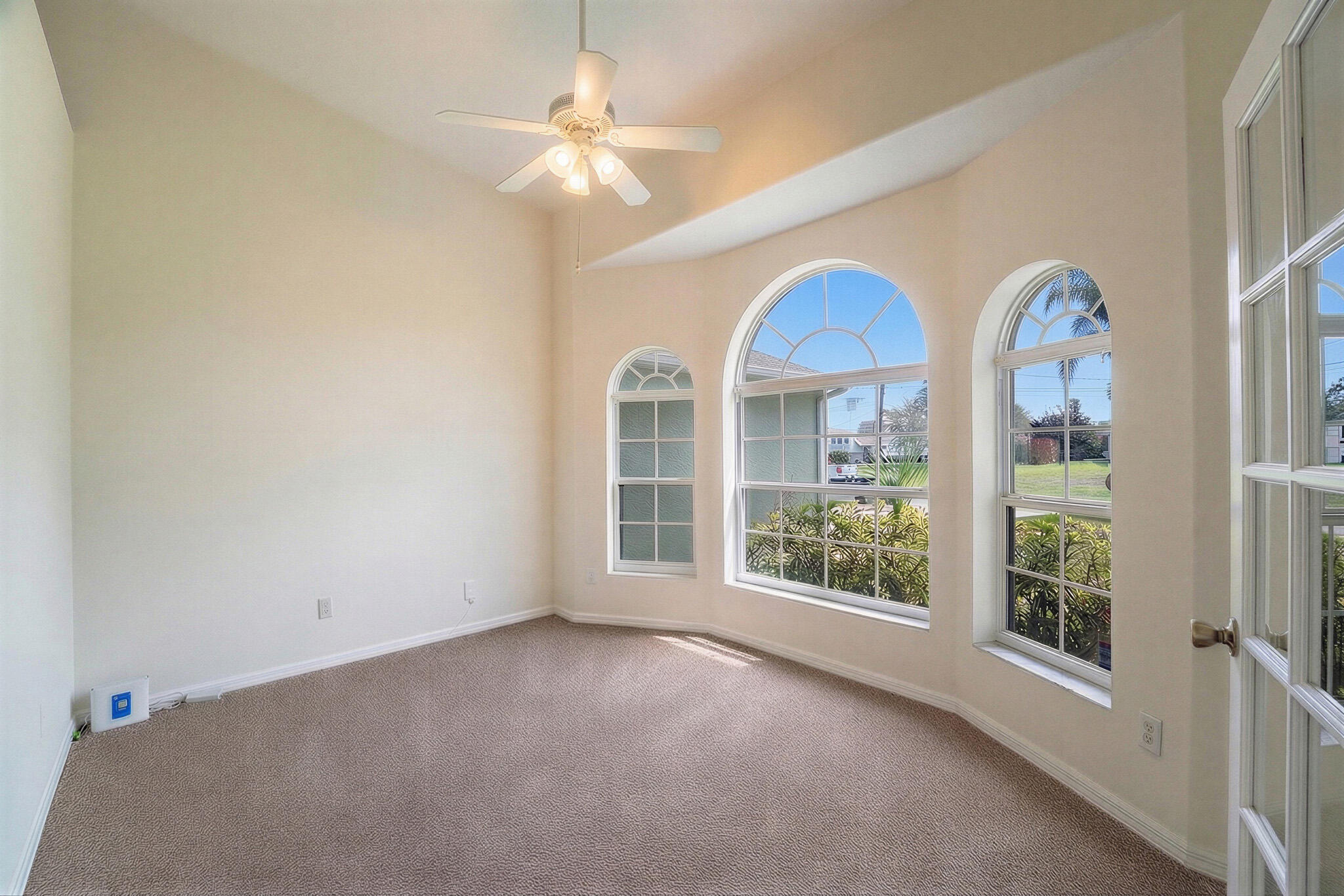 513 Southeast Cliff Road Port St. Lucie, FL 34984 - Photo 8 of 31 a view of a room with windows and chandelier