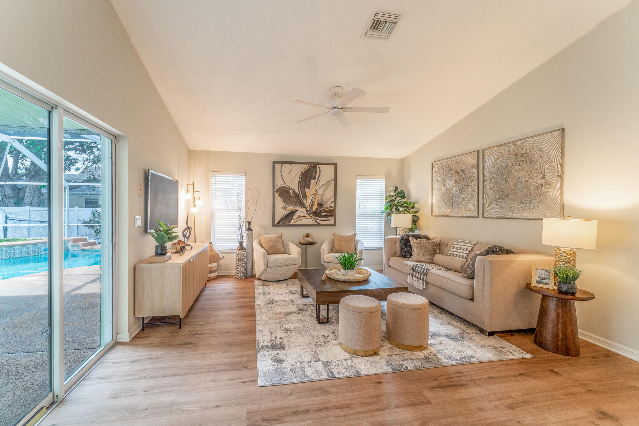 513 Southeast Cliff Road Port St. Lucie, FL 34984 - Photo 9 of 31 a living room with furniture and wooden floor