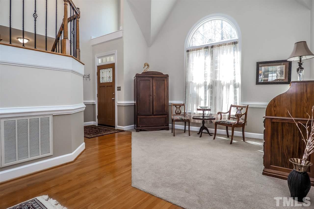 2028 Muirfield Village Way Raleigh, NC 27604 - Photo 4 of 20 With this view you can see the upgraded door and iron balusters.