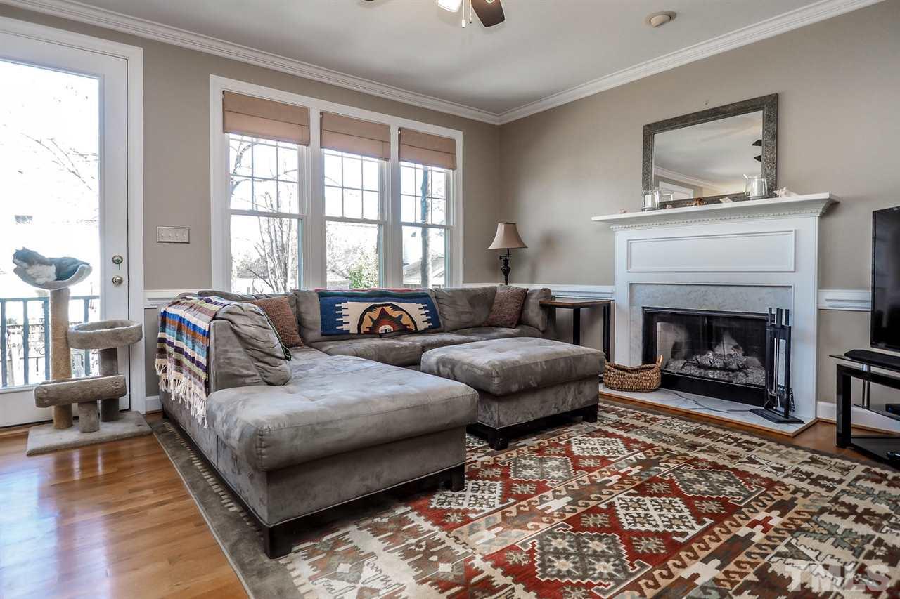 2028 Muirfield Village Way Raleigh, NC 27604 - Photo 10 of 20 Large room with a fireplace to cozy up to.