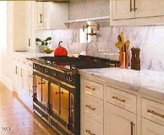 a kitchen with stainless steel appliances granite countertop a stove and a sink