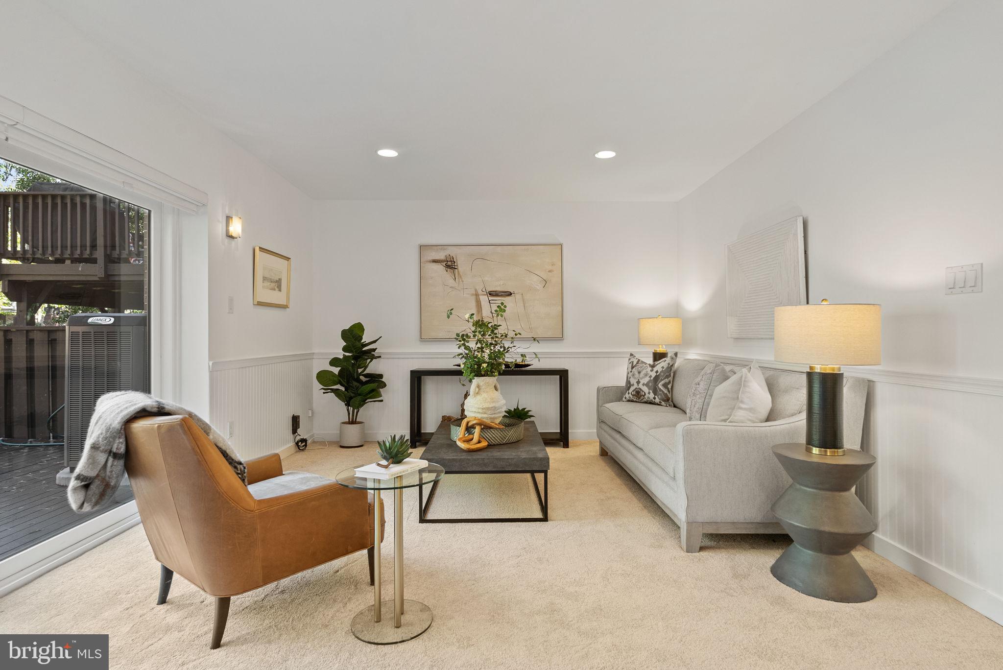 11026 Saffold Way Reston, VA 20190 - Photo 1 of 30 a living room with furniture and a lamp