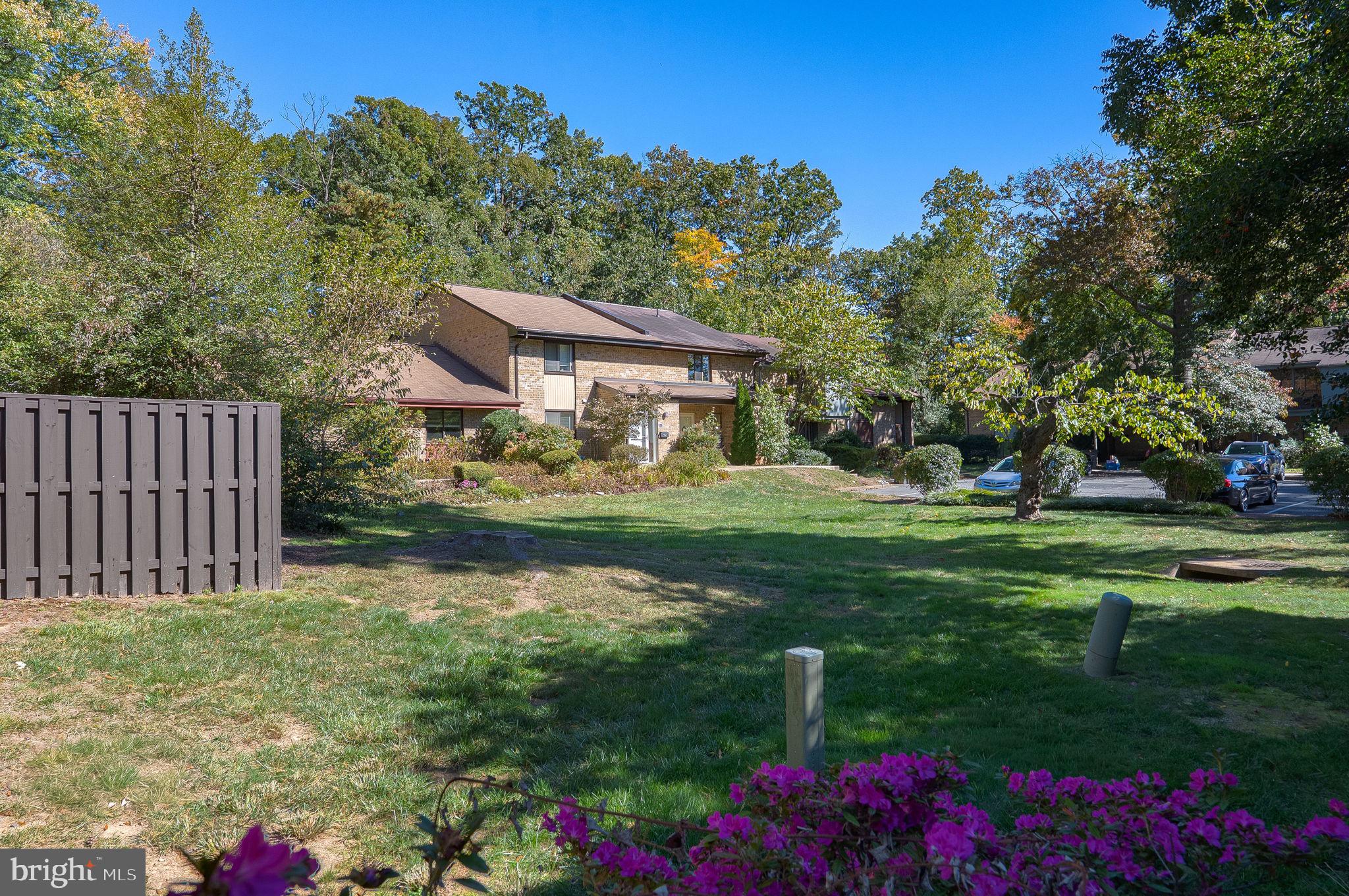 11026 Saffold Way Reston, VA 20190 - Photo 19 of 30 a front view of a house with garden