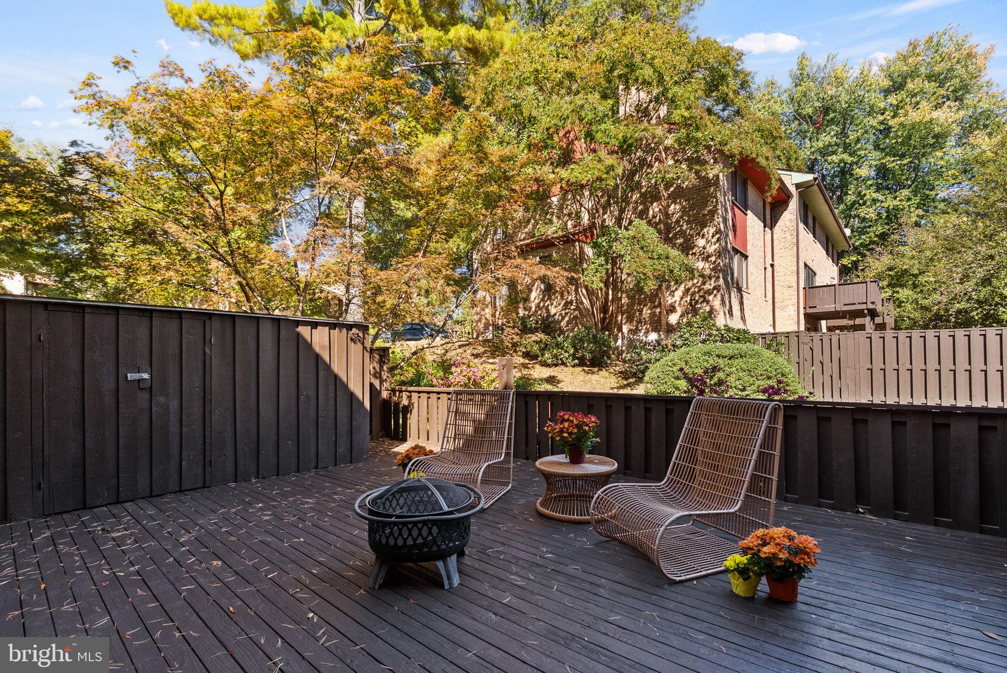 11026 Saffold Way Reston, VA 20190 - Photo 25 of 30 a backyard of a house with table and chairs