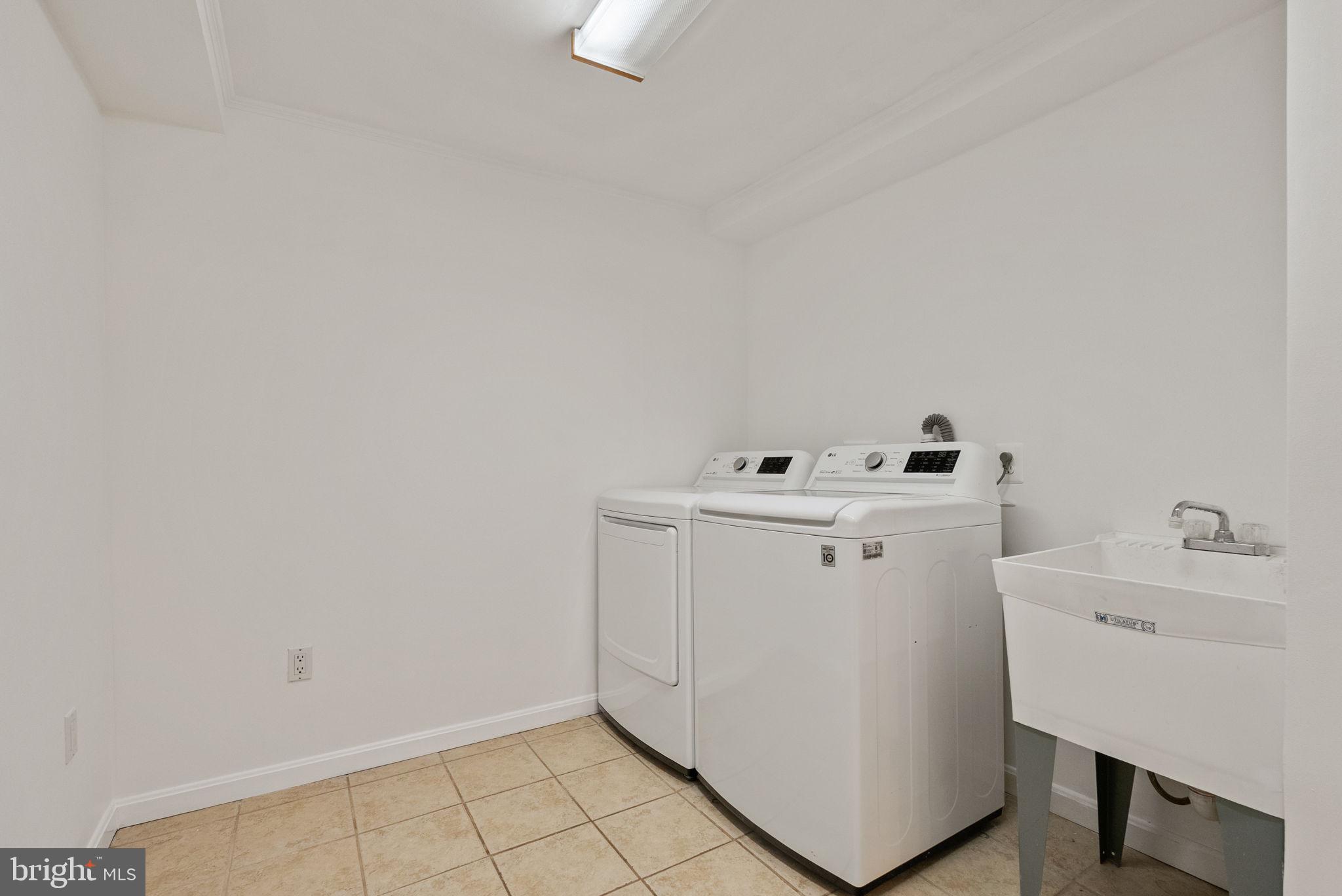 11026 Saffold Way Reston, VA 20190 - Photo 30 of 30 a utility room with dryer and washer