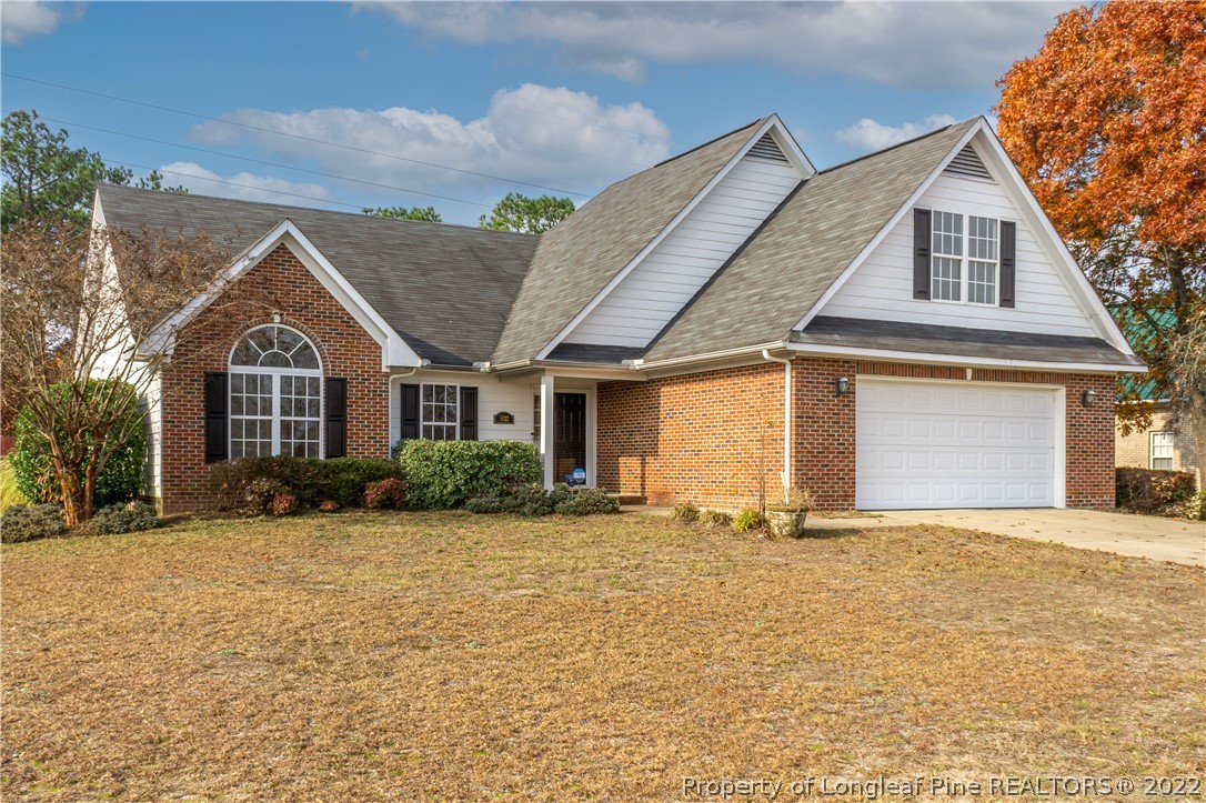 5622 Spreading Branch Road Hope Mills, NC 28348 - Photo 1 of 40 a front view of a house with a yard