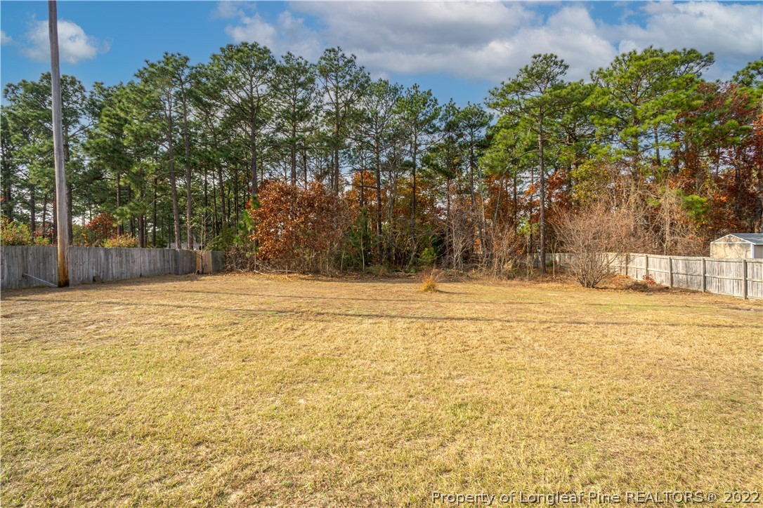5622 Spreading Branch Road Hope Mills, NC 28348 - Photo 38 of 40 a swimming pool with an outdoor space and seating area