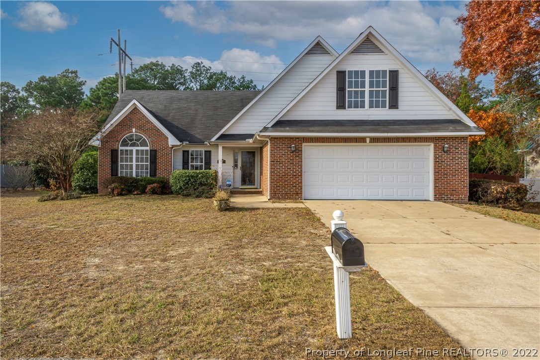 5622 Spreading Branch Road Hope Mills, NC 28348 - Photo 40 of 40 a front view of a house with a yard and garage