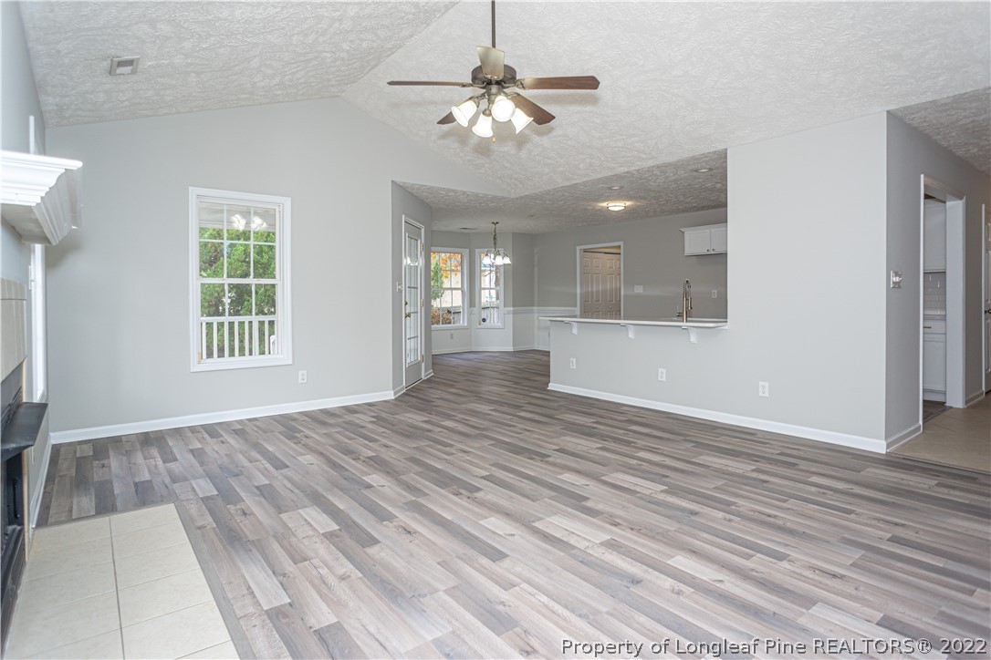 5622 Spreading Branch Road Hope Mills, NC 28348 - Photo 10 of 40 a view of an empty room with window and wooden floor