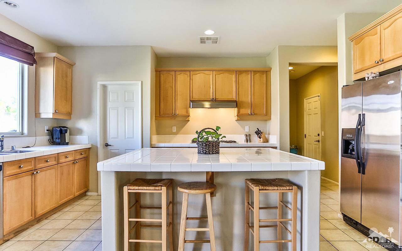 83330 Lightning Road Indio, CA 92203 - Photo 11 of 39 a kitchen with stainless steel appliances granite countertop a sink and cabinets