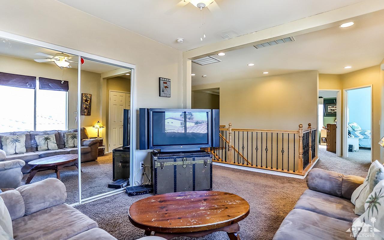83330 Lightning Road Indio, CA 92203 - Photo 19 of 39 a living room with furniture and wooden floor