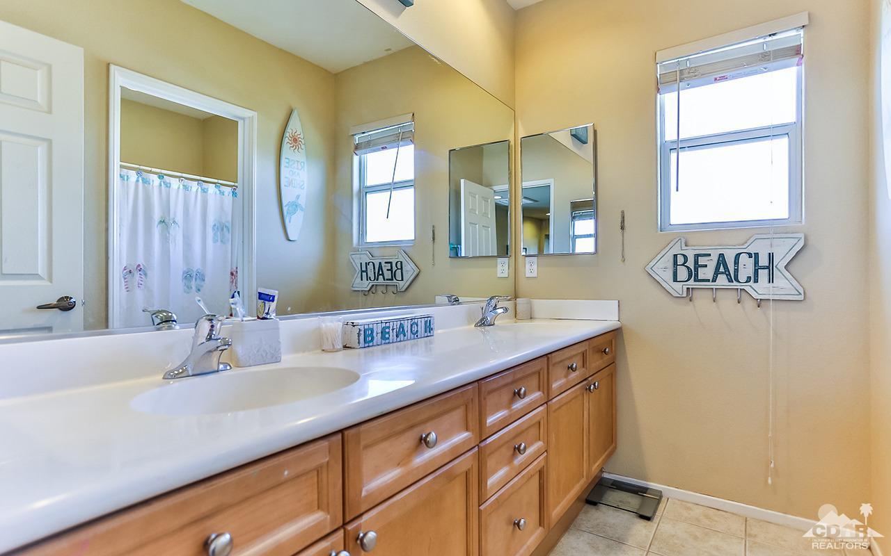 83330 Lightning Road Indio, CA 92203 - Photo 21 of 39 a bathroom with a sink and a mirror