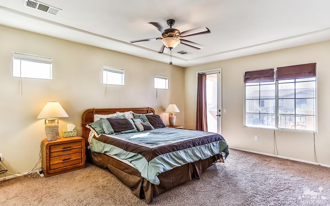 83330 Lightning Road Indio, CA 92203 - Photo 26 of 39 a bedroom with a bed and window