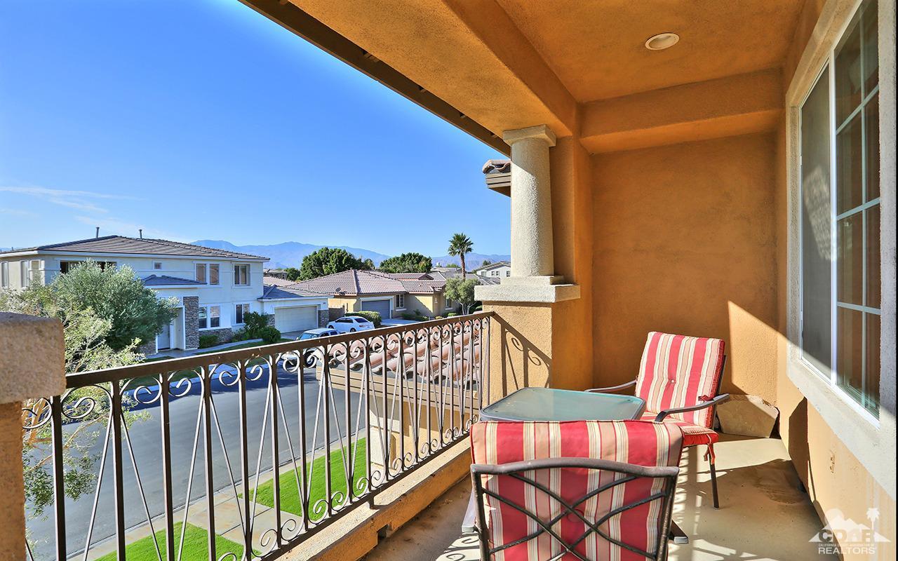 83330 Lightning Road Indio, CA 92203 - Photo 31 of 39 a view of a chairs and table in the balcony