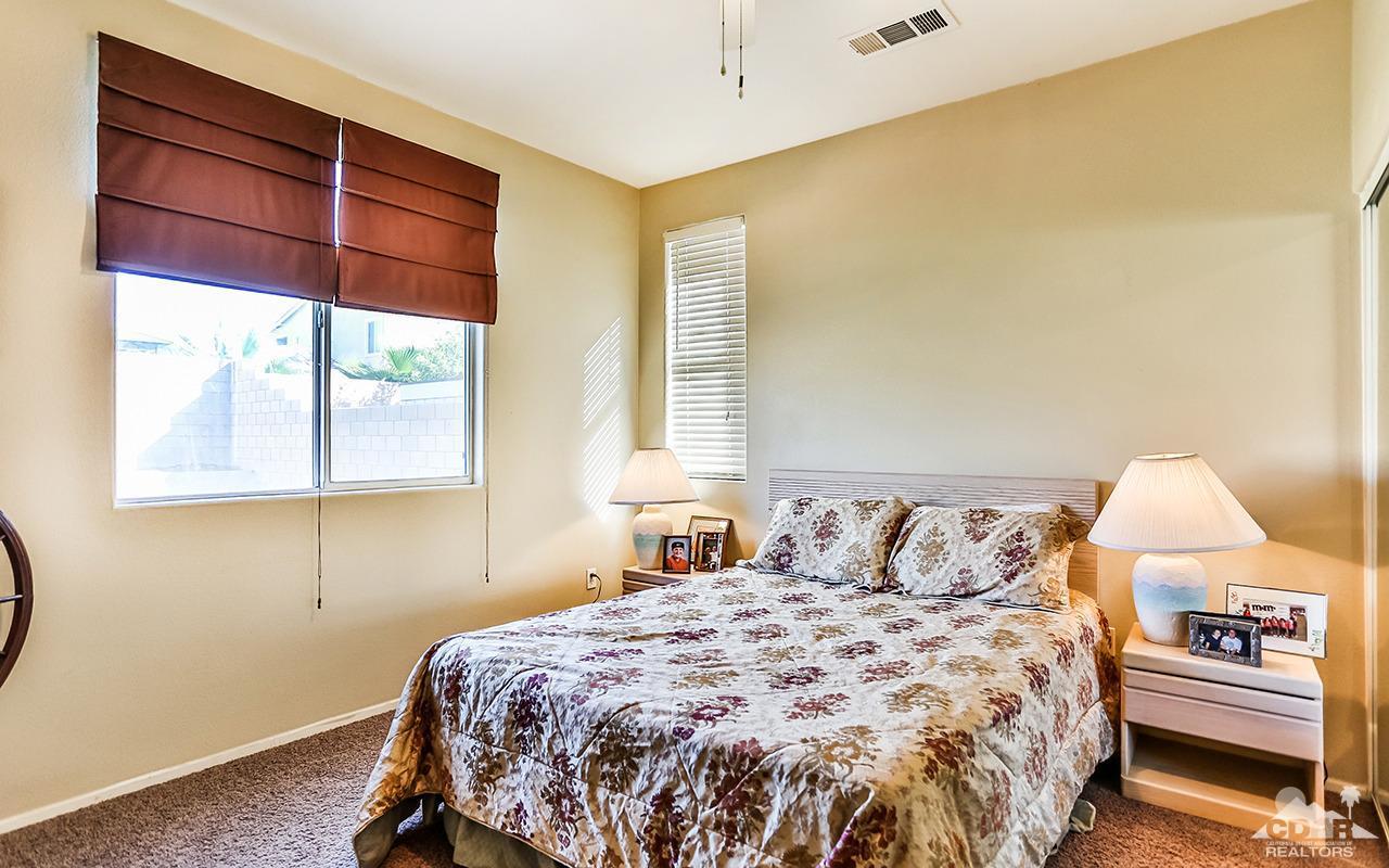 83330 Lightning Road Indio, CA 92203 - Photo 32 of 39 a bedroom with a bed and a window