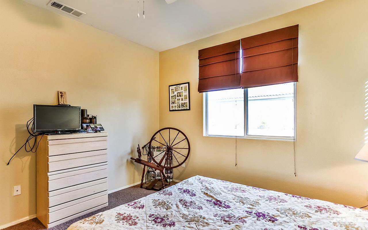 83330 Lightning Road Indio, CA 92203 - Photo 34 of 39 a bedroom with a bed and a window